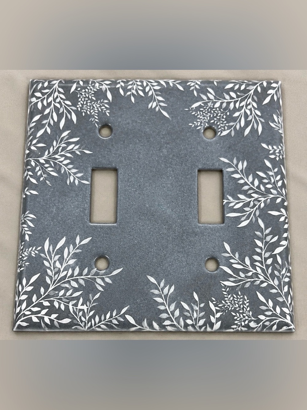 Gray Double Toggle Wall Plate with White Leaf Design